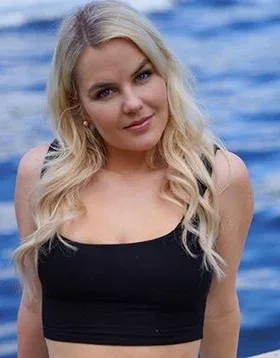 Slimthick Vic in a black top by the water